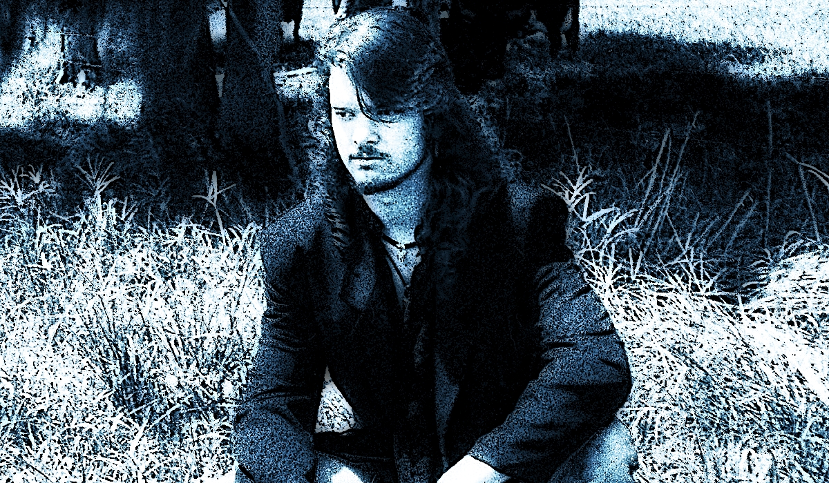 David Sloan in a cow field from a Question Number Nine photo shoot in 1992